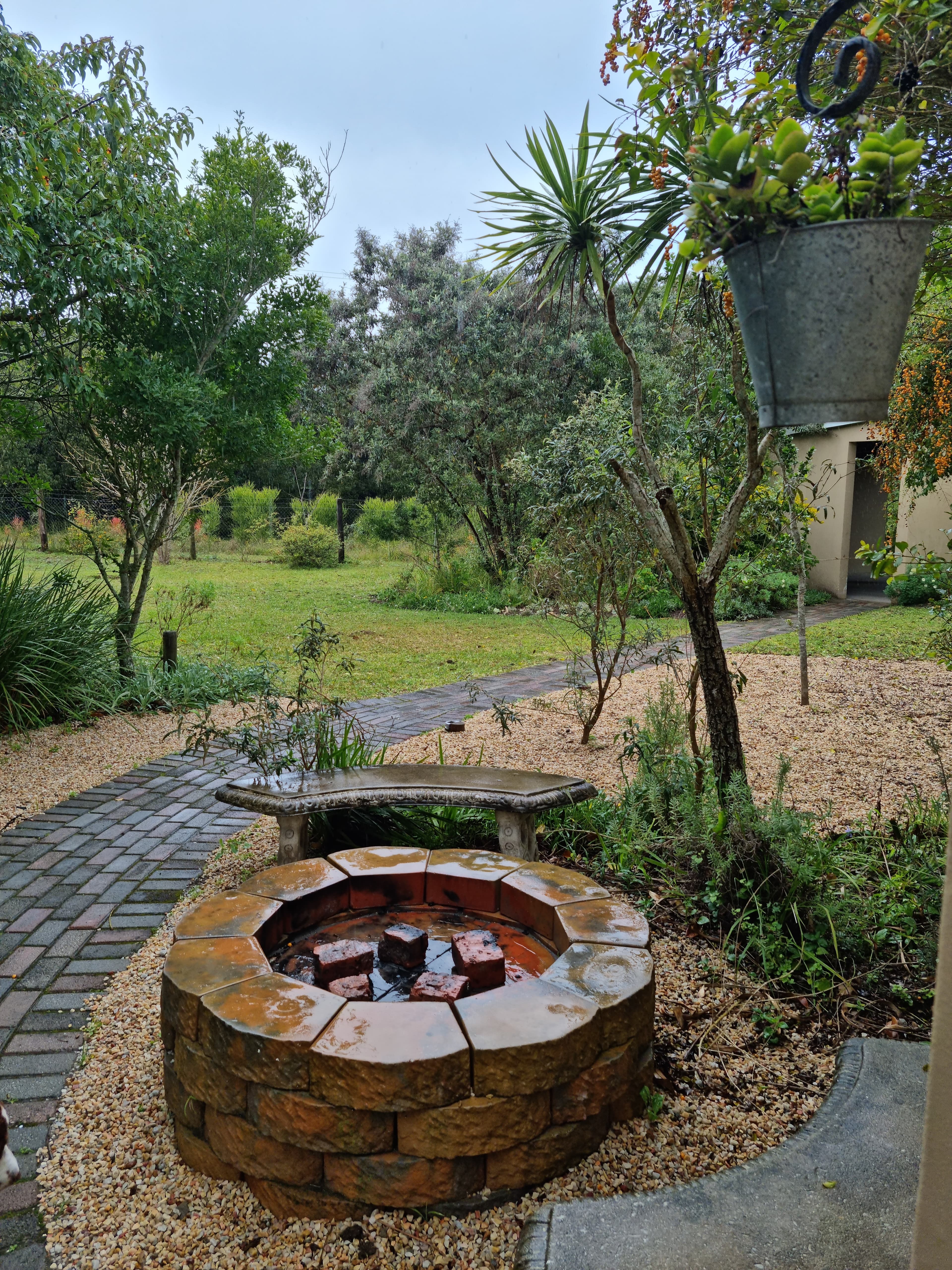 Outdoor fireplace and braai area at Little Louisa