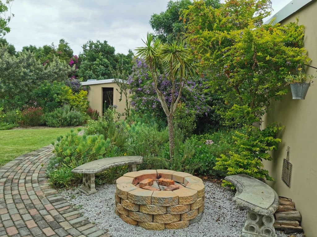 Evening fireplace setting at Little Louisa guest house
