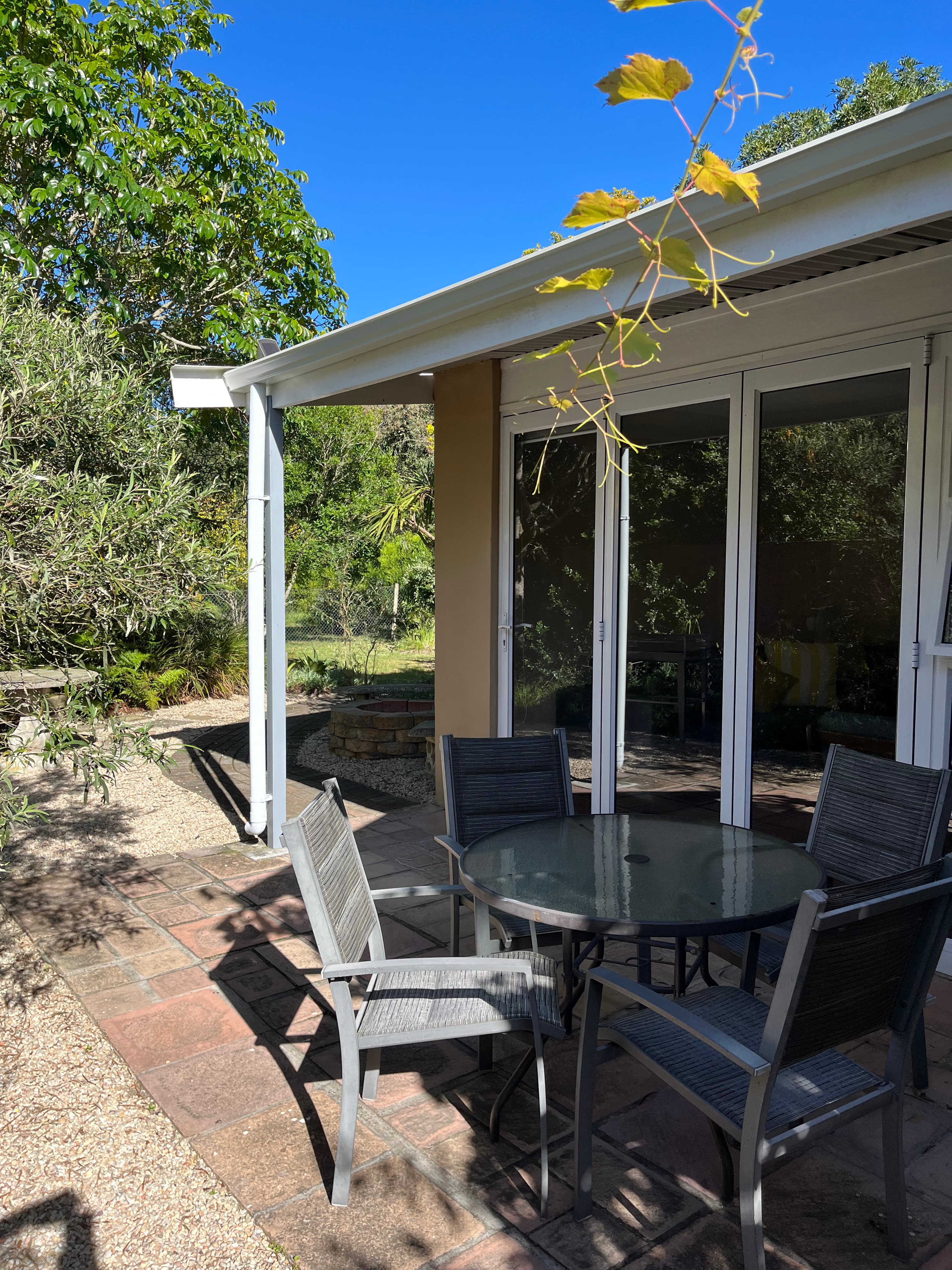 Al fresco dining area in the garden at Little Louisa
